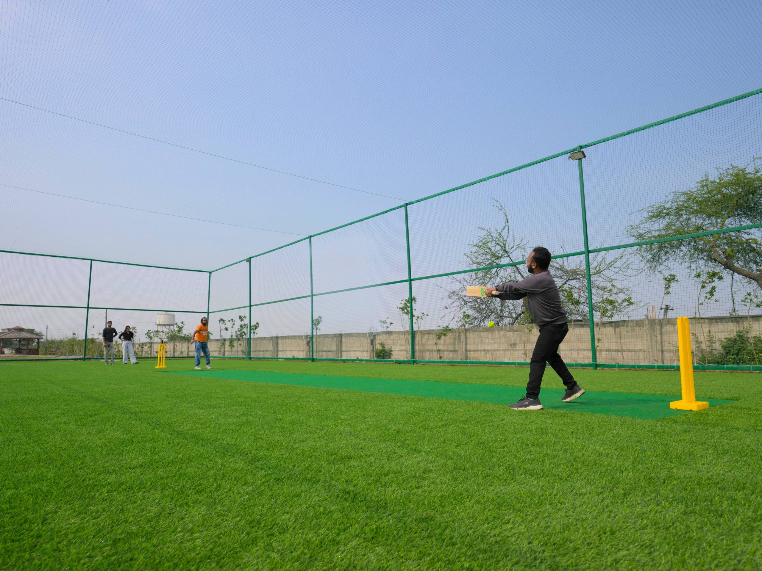 Image of cricket turf area within the scenic Gauri Greens Colony developed by Kalpdham Builders